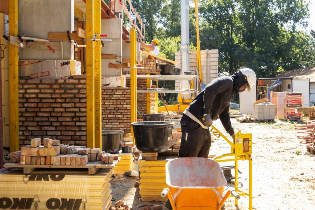 Masonry team building exterior walls